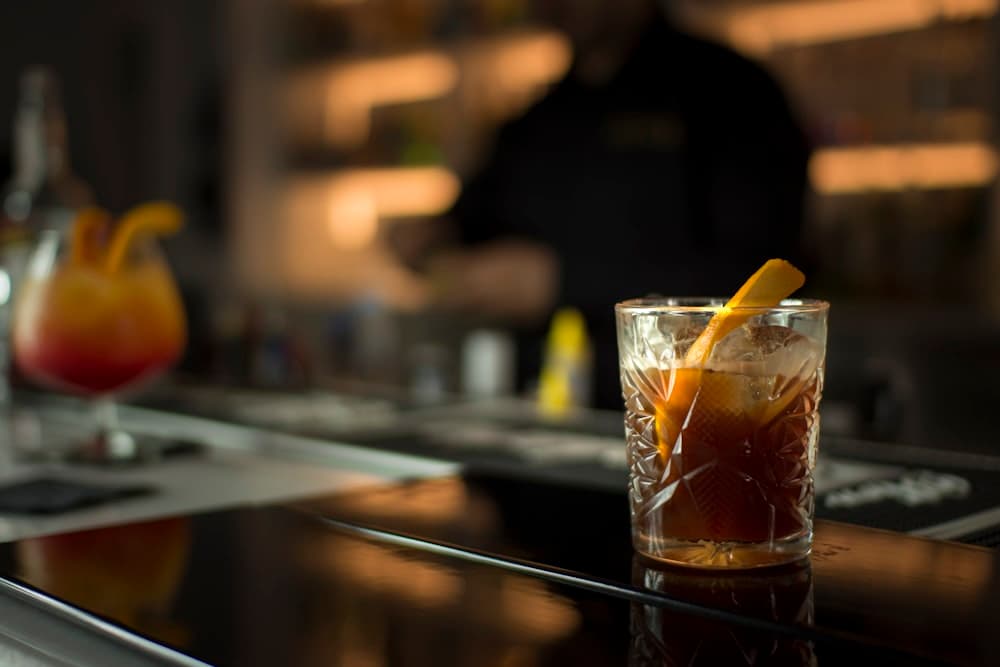 A cocktail, low-lit